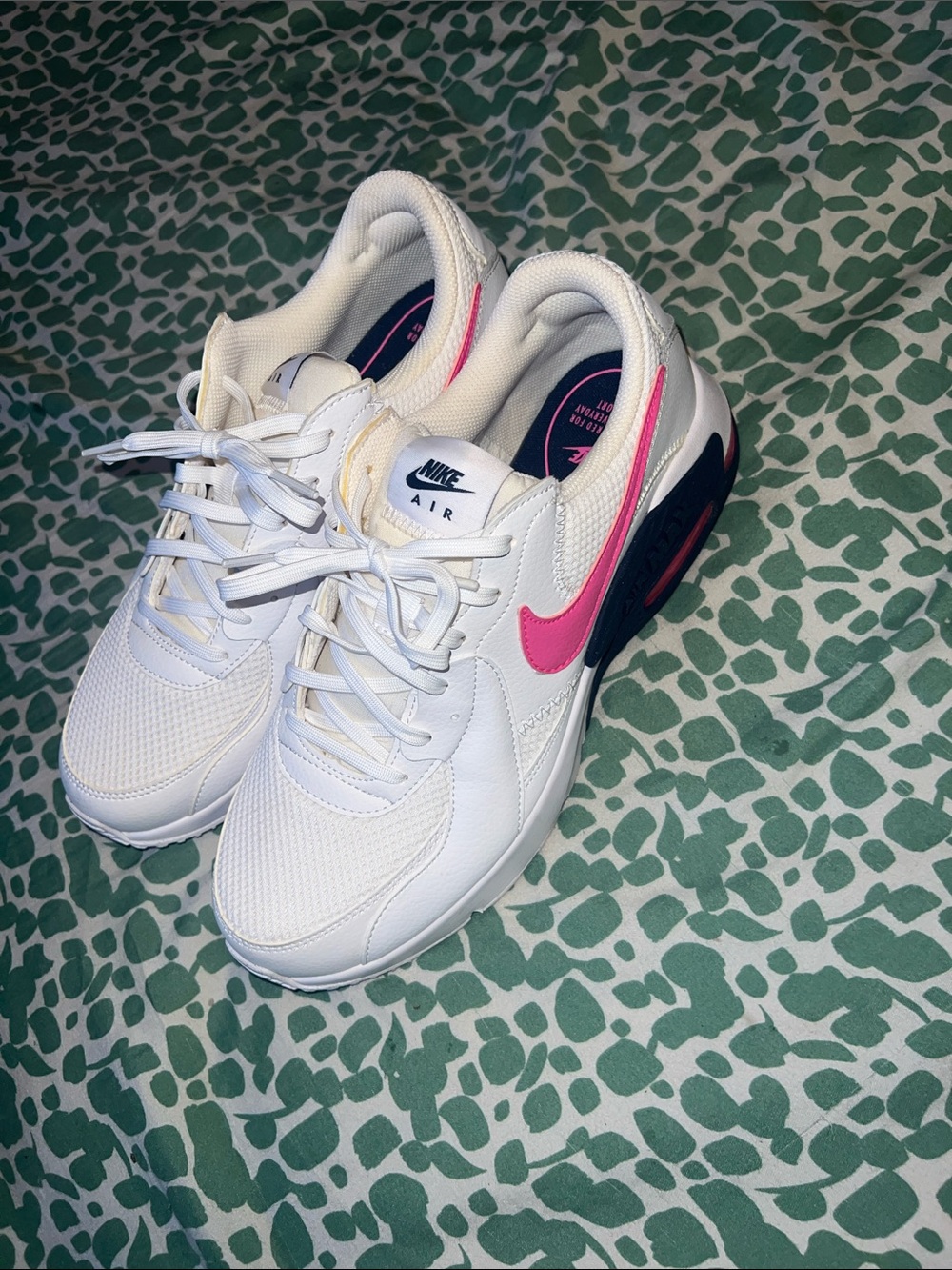 Nike Women's White Sneakers with Pink Swoosh and Navy Heel